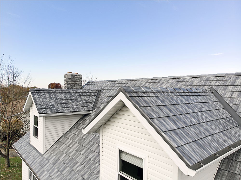 Roof on a Chicago, IL home - white with grey shingles and gutter guards