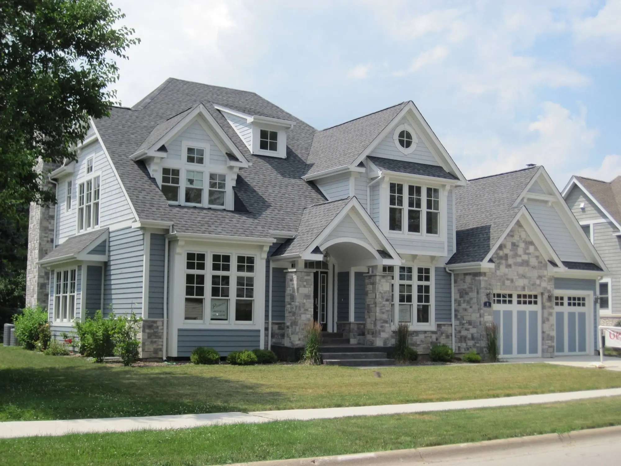 Premium Materials Transform Faded Home into Neighborhood Standout