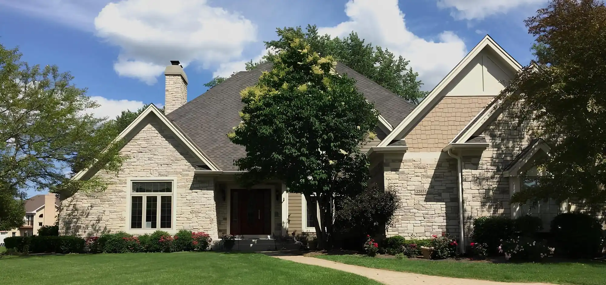 Architectural Stone and Hardie Shingles Elevate Kildeer Home