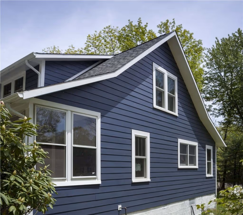 Service Areas. Charming home exterior featuring HXHome Solutions' elegant blue siding, creating a timeless and stylish facade.